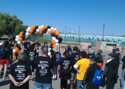 Picture of Ceci Navarro Tanner welcoming Walk/Race participants from a few years ago
